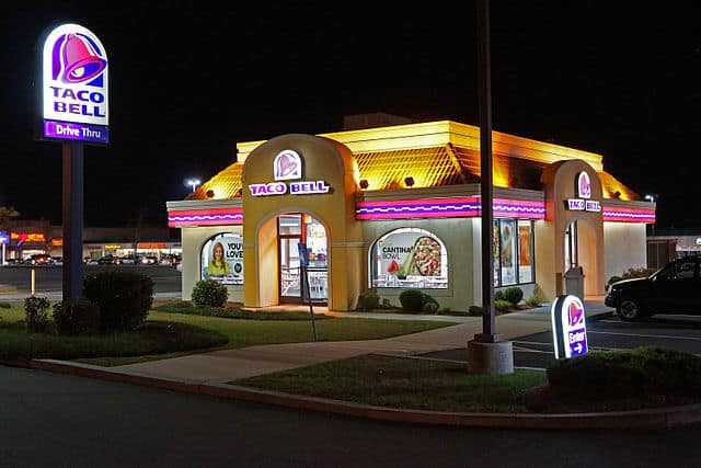 Photo by Anthony92931 - https://en.wikipedia.org/wiki/Taco_Bell#/media/File:Taco_Bell_Night.JPG